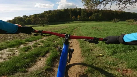 Mountain Biking On A Very Bumpy Dirt Road. Autumn Sun Stock Footage 217403554
