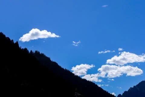 Mountain on blue sky with clouds background in Kashmir , India Stock Photos