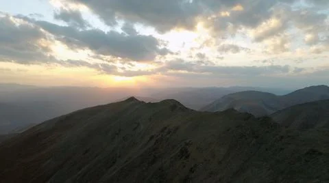 A mountain breathtaking river flows through the tranquil plain under the large Stock Photos