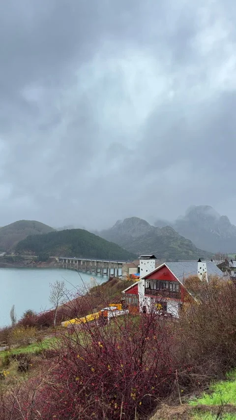 Mountain bridge crossing river in dramatic Picos de Europa landscape 스톡 동영상 339216177