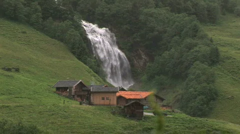 Mountain cabin with big waterfall Stock Footage 106209