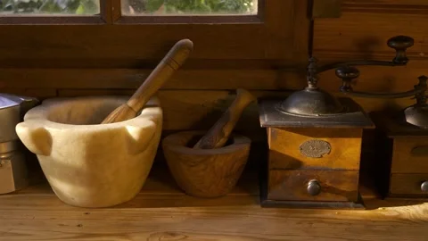 Mountain cabin kitchen with grinders, mortars, coffee pots and teapots Stock Footage 221645054