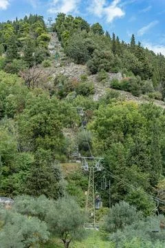 A mountain with a cable car Funivia colle eletto going up the side in Gubbi.. Stock Photos