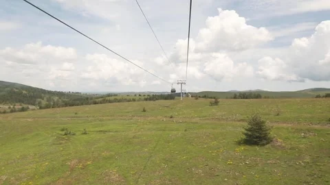 Mountain cable car gondola view from another cabin Stock Footage 247629327