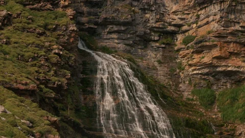 Mountain cascade flowing through rocky cliffs near Mont Perdu range, Aragon Stock Footage 342841420