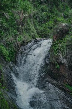 Mountain cascade waterfall inside of wild tropical forest Stock Photos