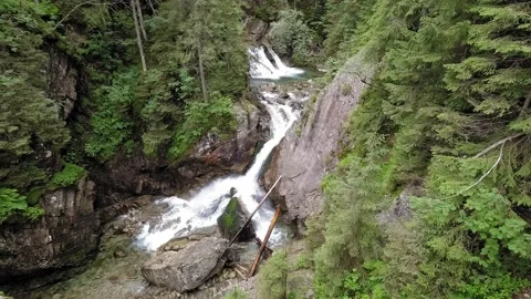 Mountain cascade waterfall, river or spring in the mountains. Video stock 211824209