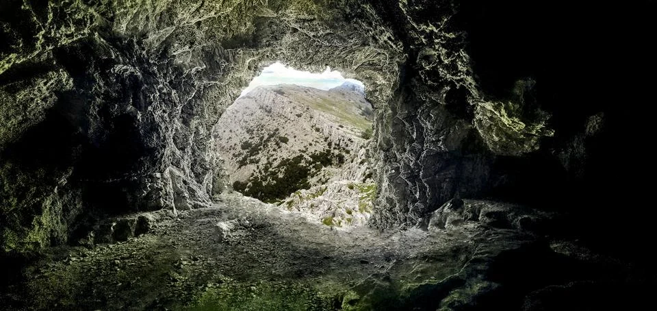 Mountain cave view Stock Illustration