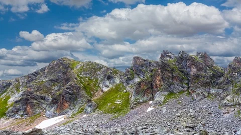 Mountain chain on a cloudy sky background time lapse scene Stock Footage 101419309