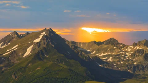 Mountain chain in a snow at the dramatic sunset 스톡 동영상 250155501