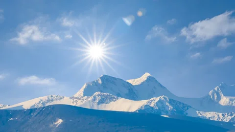 Mountain chain in snow at hot sunny day Stock Footage 342099653