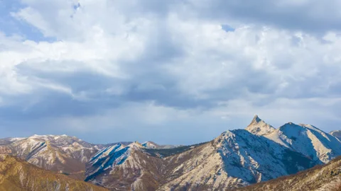 Mountain chain in snow under blue sky Stock Footage 328238201