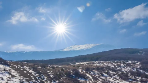 Mountain  chain in a snow under a sparkle sun Stock Footage 329670768
