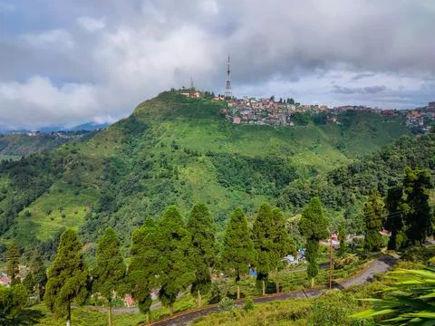 Mountain city view with bright dramatic sky at morning from flat angle Stock-Fotos