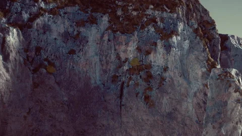 Mountain cliff above ground with visible natural texture in sunlight Stock Footage 340226122