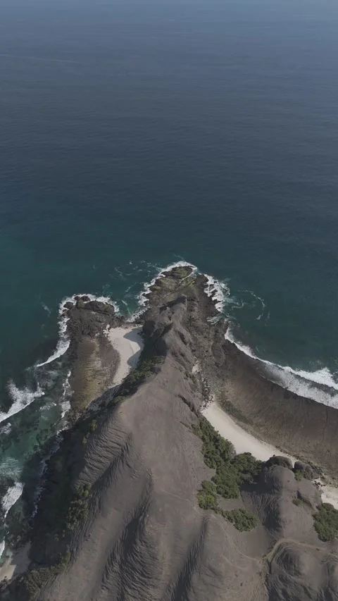 Mountain cliff and Sea vertical 4K DLog Video stock 286804780