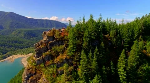 Mountain cliff by a blue lake Stock Footage 53307736