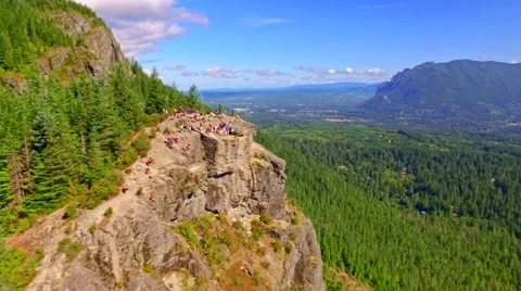 Mountain cliff by a blue lake Stock Footage 53307776