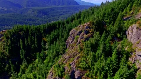 Mountain cliff by a blue lake Stock Footage 53307791