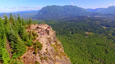 Mountain cliff by a blue lake Stock Footage 53308089