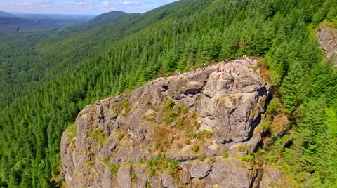 Mountain cliff by a blue lake Stock Footage 53308190