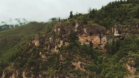 Mountain cliff with clouds and trees Stock Footage 154876472