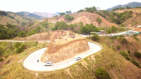 Mountain Cliff Overlooking Scenic Road and Visitors Stockbeeldmateriaal 337784041