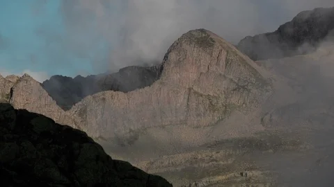 Mountain Cliff  Seen Through Semitransparent Clouds Timelapse Stock-Footage 87283336
