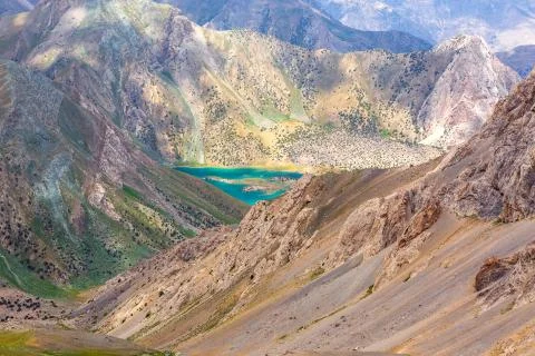 Mountain cliffs and lake Stock Photos