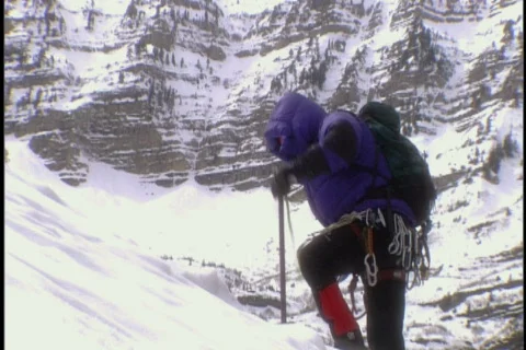Mountain climber ascends mountain Stock Footage 443725