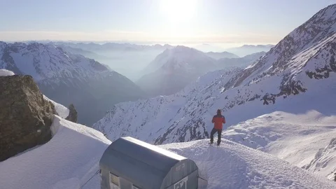 Mountain climber that looks at the valley, Simplon Pass, Switzerland Stock Footage 116124832
