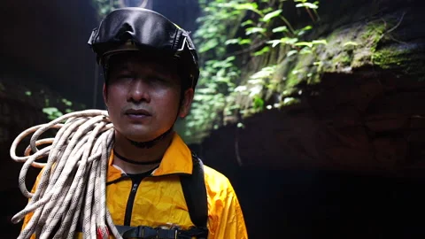 Mountain climber man in the uniform Stock Footage 133799024
