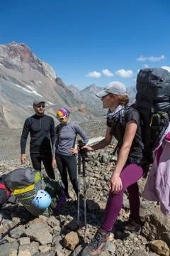 Mountain climbers preparing for ascent Stock Photos