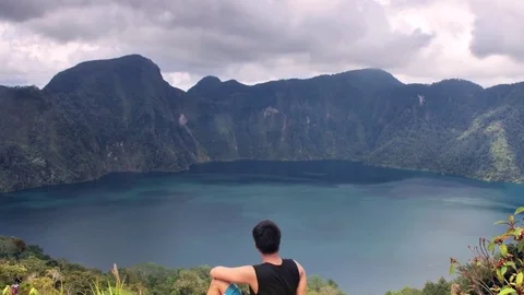 Mountain Climbing, Man Sitting At The Summit of A Volcano, Wanderlust. Video stock 91536711