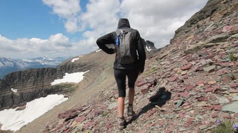 Mountain climbing towards summit peak female Stock Footage 8573797