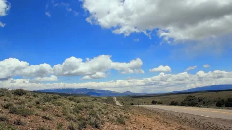 Mountain Clouds and Road Timelapse Stock Footage 5652790