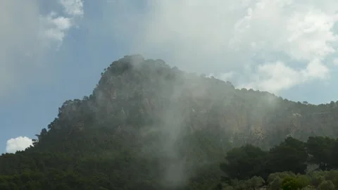 Mountain in clouds, Mallorca, Majorca, Balearic Islands, Spain Видео 303754034