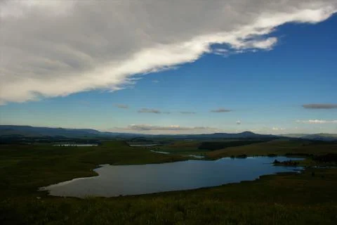 Mountain Clouds Reflected in Pond Stock Photos