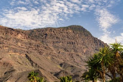 A mountain with a cloudy sky in the background Stock Photos