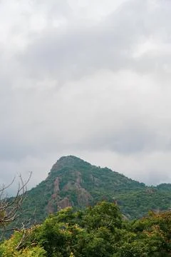 A mountain with a cloudy sky in the background Fotos Stock