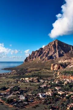 Mountain on a coast Stock Photos