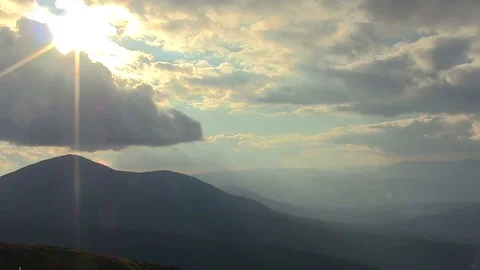  Mountain colorful landscape  with clouds and sunbeams, timelapse, PAL Stock Footage 79596138
