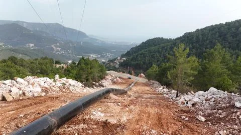 Mountain construction drone view coniferous forest Stock Photos