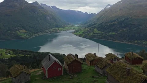 Mountain cottages surrounded by vibrant greenery in Rakssetra, Norway Stock Footage 320995204