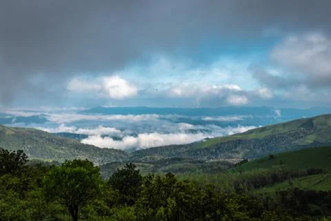 Mountain coverd with cloud layers and beautiful sky Photos