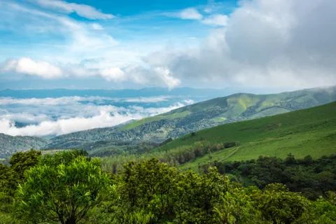 Mountain coverd with cloud layers and beautiful sky 写真素材