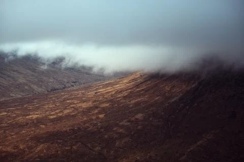 Mountain covered with clouds Stock Photos