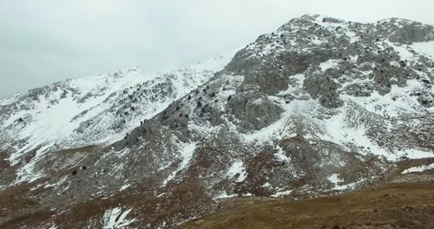 A Mountain Covered with Some Snow, 4k Aerial View Stock Footage 171251555