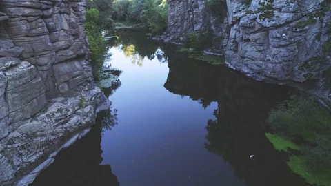 Mountain creek running between vertical rocky walls in the Carpathian in summer Stock Footage 99734424