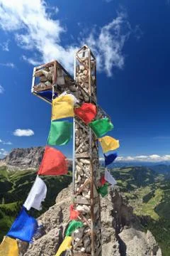 Mountain cross with flags Stock Photos